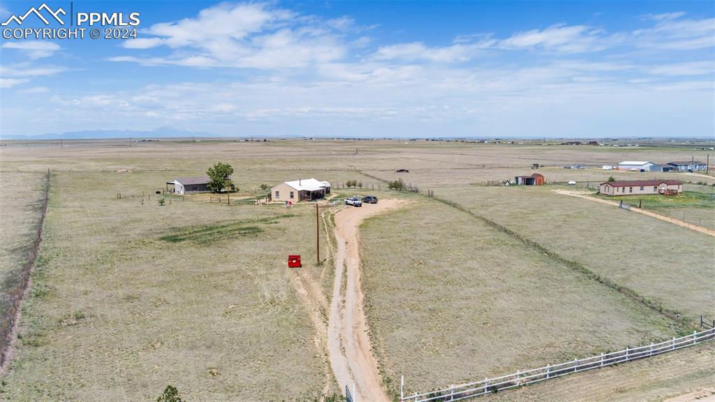 6260 Night Train Lane Yoder, CO 80864 - Photo 5 of 22 Drone / aerial view featuring a rural view