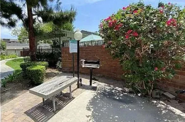 a view of a backyard with sitting area