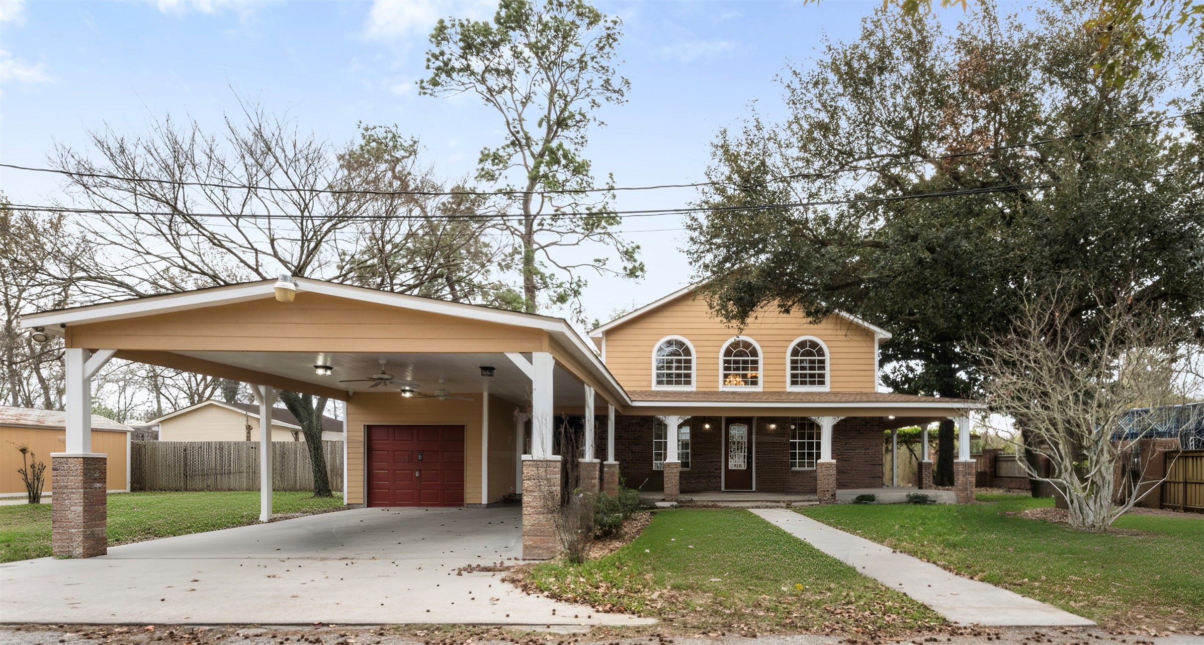 a front view of a house with a garden