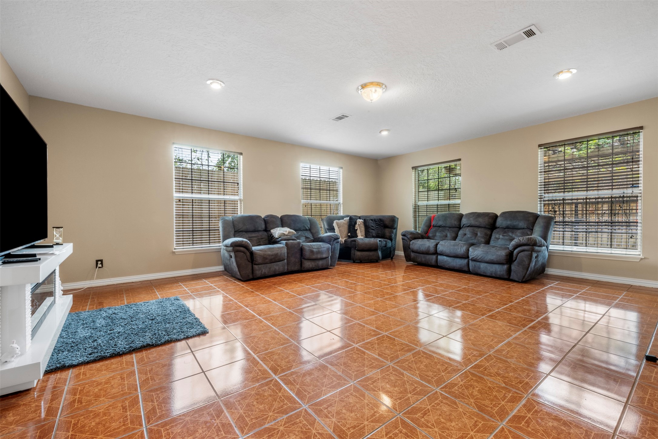 6900 Gregdale Road Houston, TX 77049 - Photo 13 of 49 a living room with furniture a flat screen tv and a window