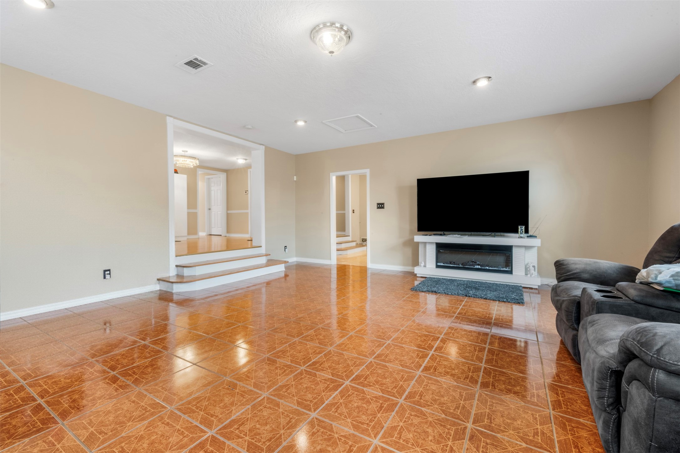 6900 Gregdale Road Houston, TX 77049 - Photo 14 of 49 a living room with furniture and a flat screen tv