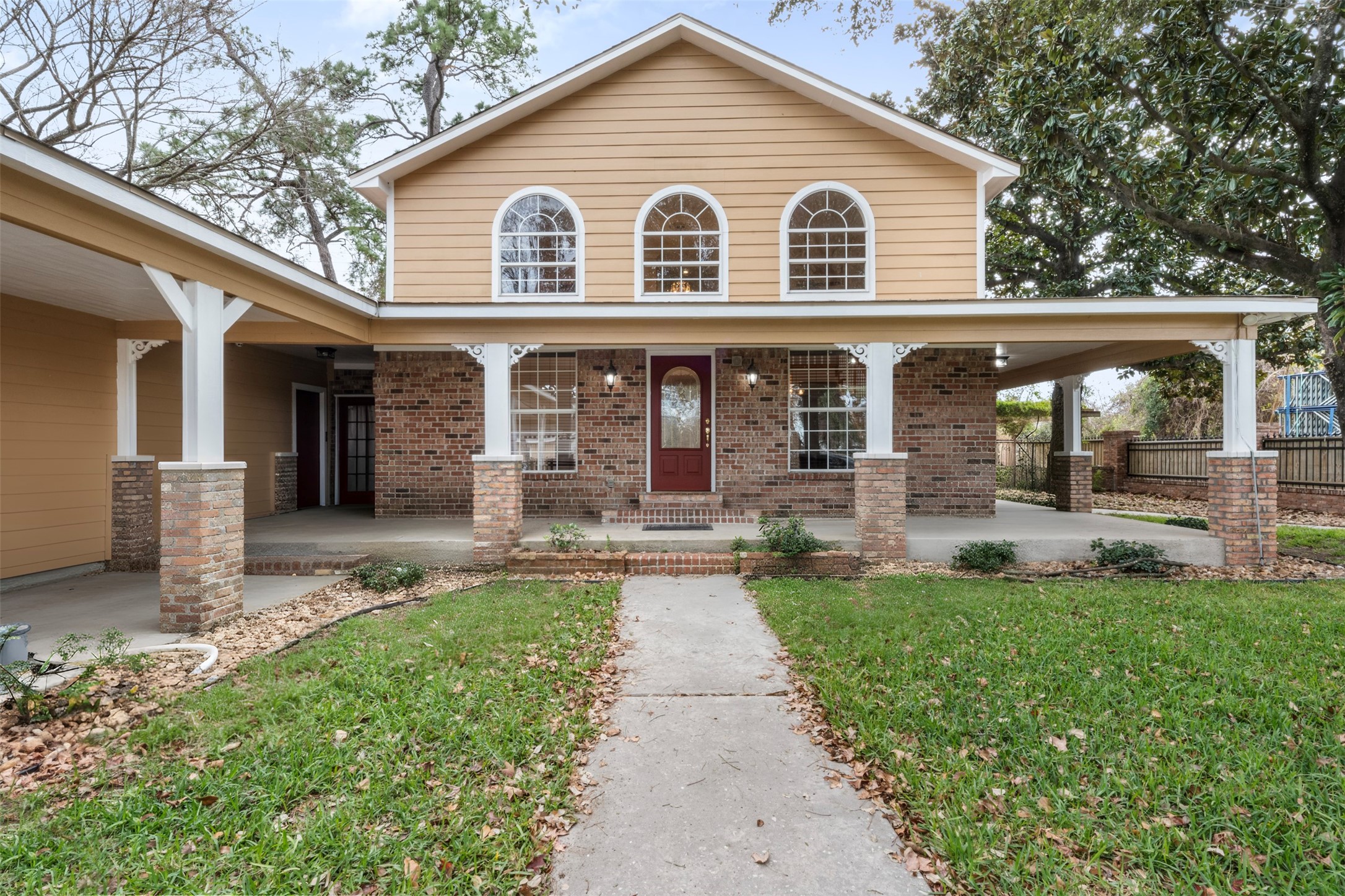 6900 Gregdale Road Houston, TX 77049 - Photo 2 of 49 a front view of a house with garden