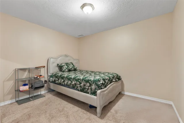 a bedroom with a bed and a cabinets