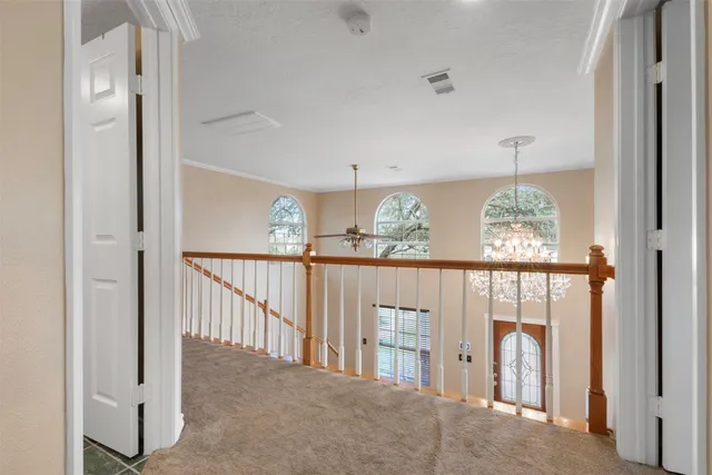 a view of a hallway with windows