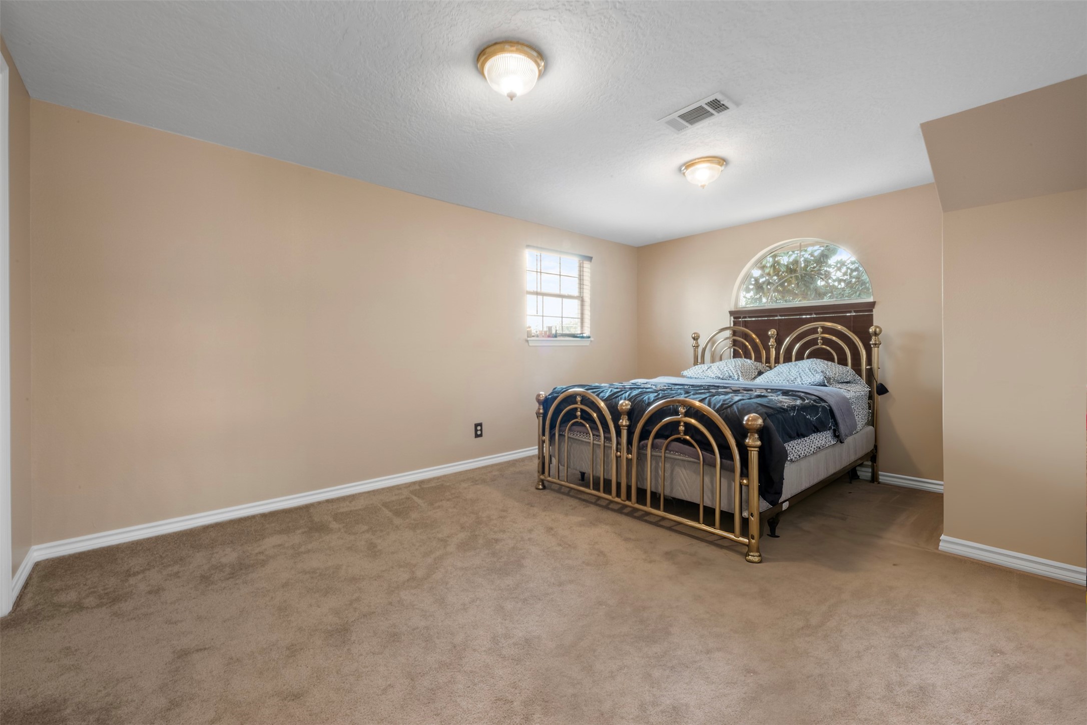 6900 Gregdale Road Houston, TX 77049 - Photo 32 of 49 a bedroom with a bed and a window