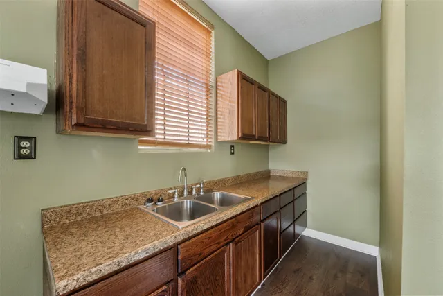 a kitchen with a sink and cabinets