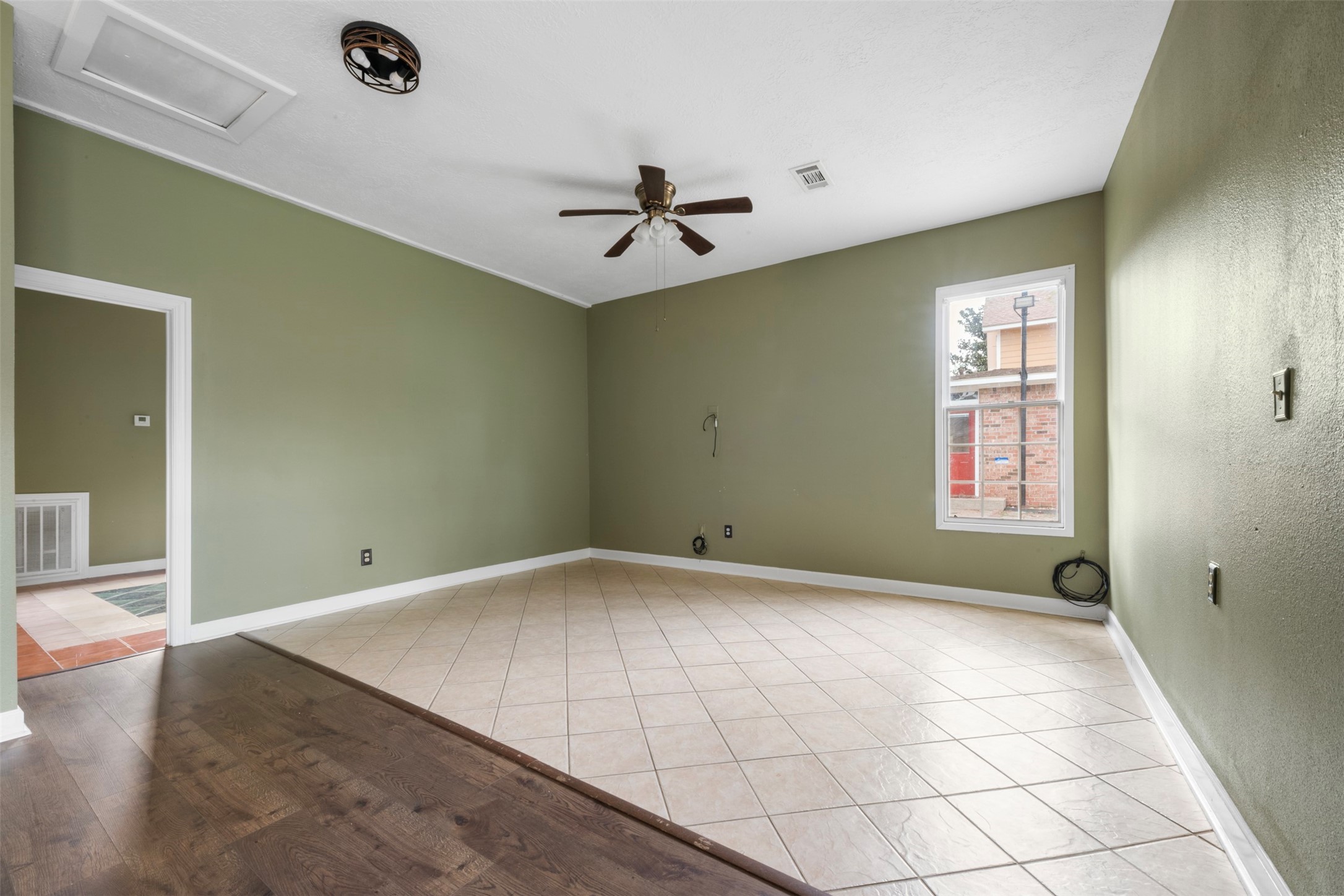 6900 Gregdale Road Houston, TX 77049 - Photo 40 of 49 an empty room with windows and fan
