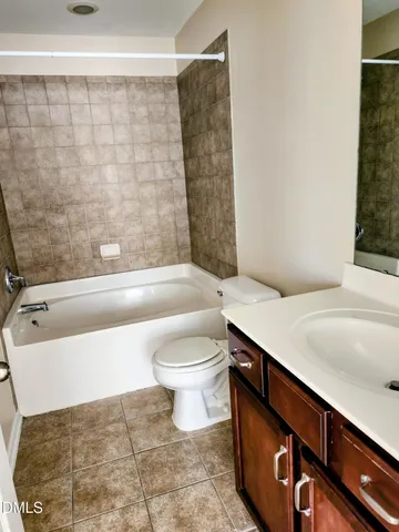 a bathroom with a sink a toilet and bathtub