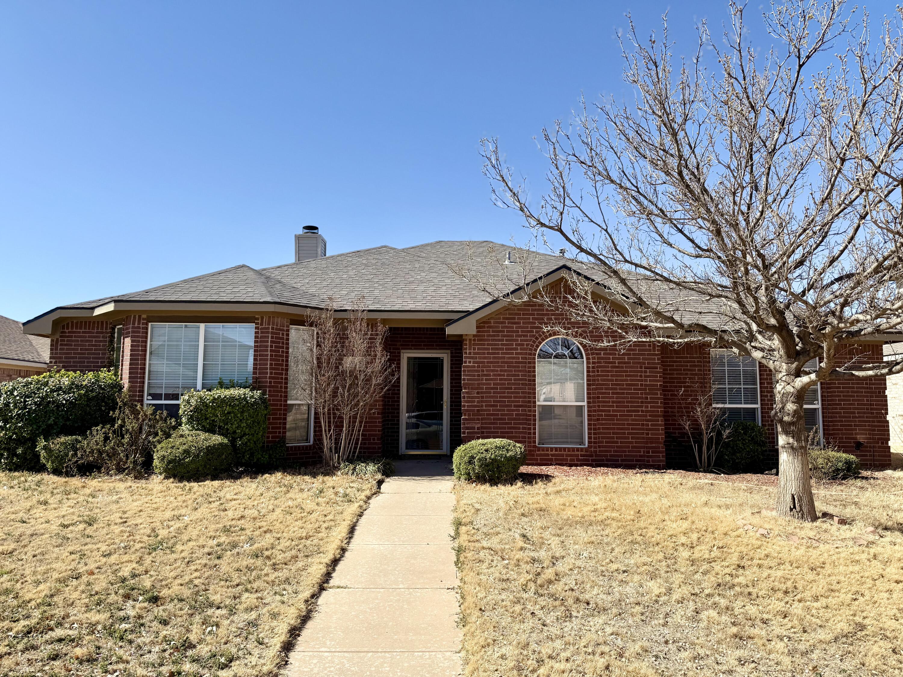 4916 Harvard Drive Lubbock, TX 79416 - Photo 1 of 22 a front view of a house with a yard