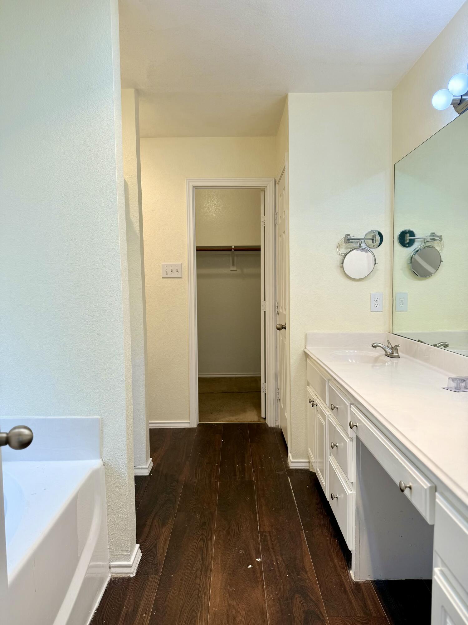 4916 Harvard Drive Lubbock, TX 79416 - Photo 14 of 22 a bathroom with a sink and a bathtub