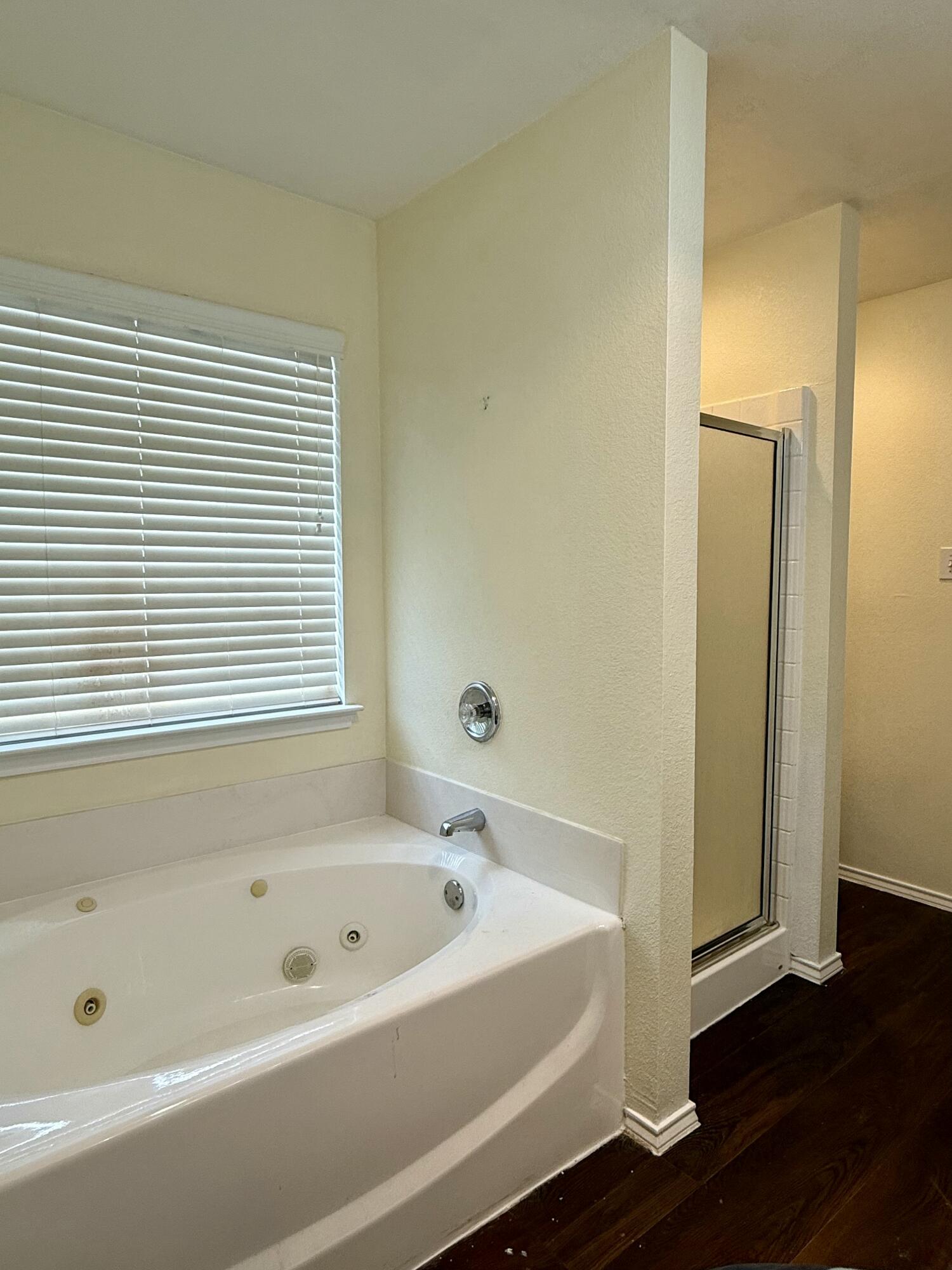 4916 Harvard Drive Lubbock, TX 79416 - Photo 15 of 22 a bathroom with a bathtub