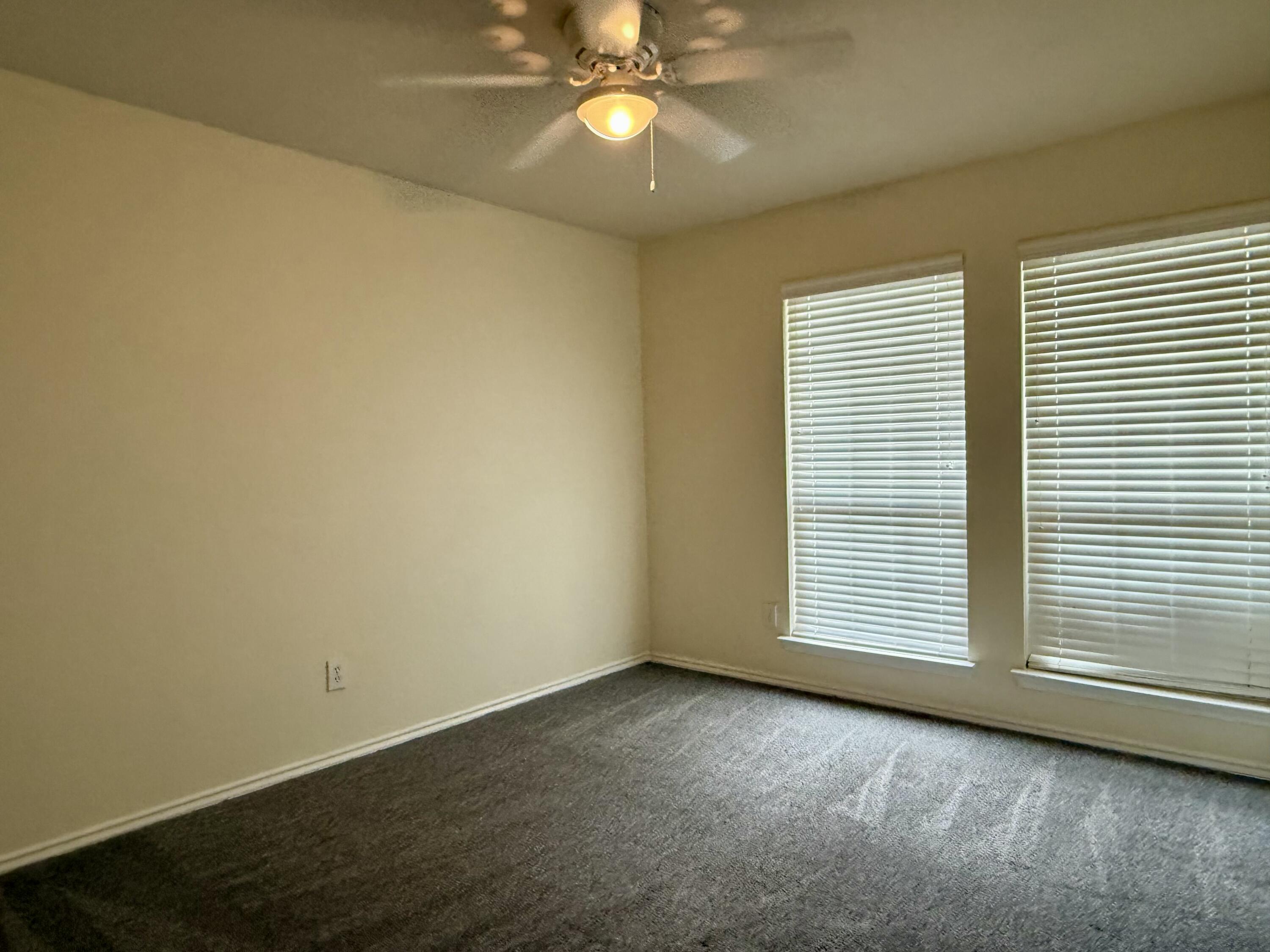 4916 Harvard Drive Lubbock, TX 79416 - Photo 18 of 22 an empty room with a window