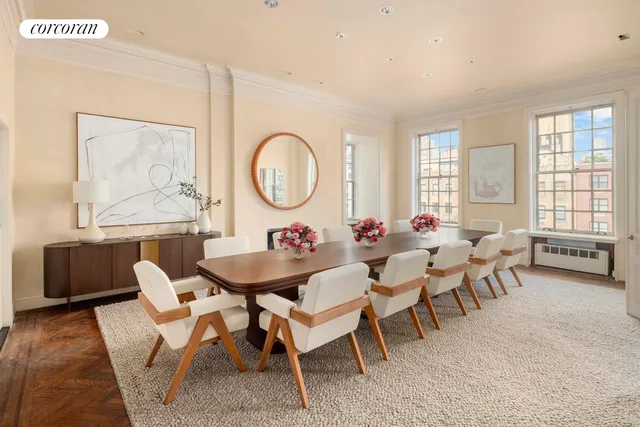 a front view of a building with outdoor seating