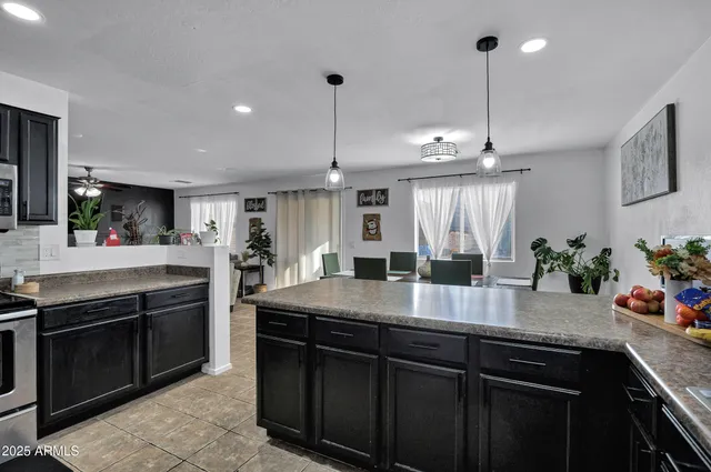 a kitchen with a sink and stove