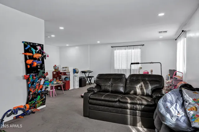 a bed room with furniture and a window