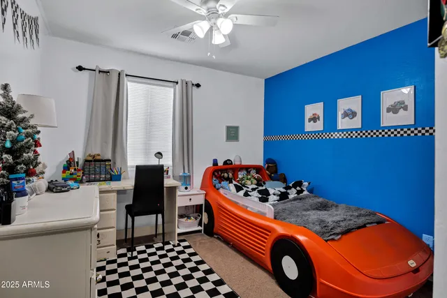 a bedroom with furniture and window