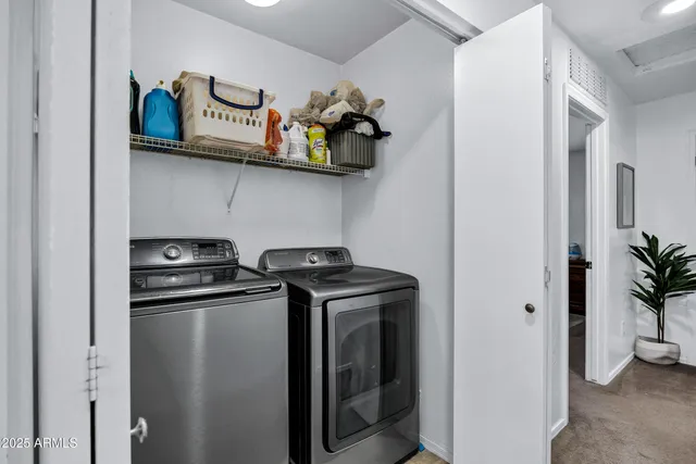 a kitchen with stainless steel appliances granite countertop a refrigerator and a stove