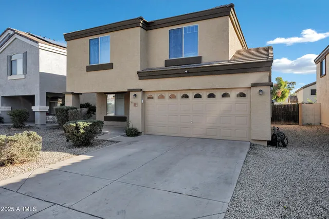 a view of a house with large windows
