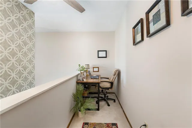 a workspace with furniture and a window