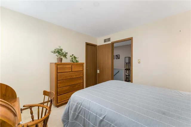 a bedroom with a bed and a closet