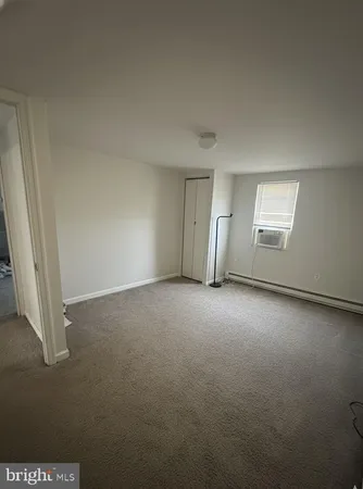 an empty room with a empty space and windows