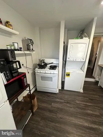 a view of kitchen with sink and wooden floor