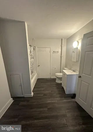 a view of a bathroom with sink and mirror