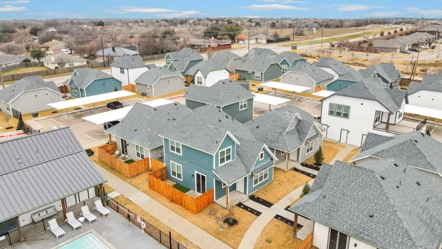 an aerial view of a house with roof deck