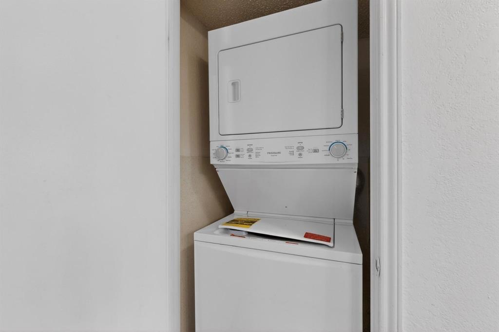 8545 Midpark Road, Unit 16 Dallas, TX 75240 - Photo 12 of 29 a close up view of a washer and dryer