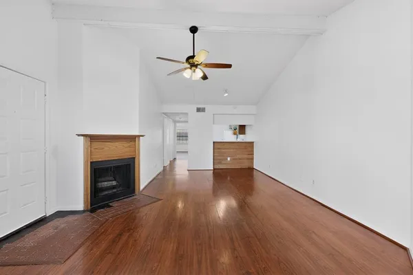 a view of kitchen and hall with wooden floor