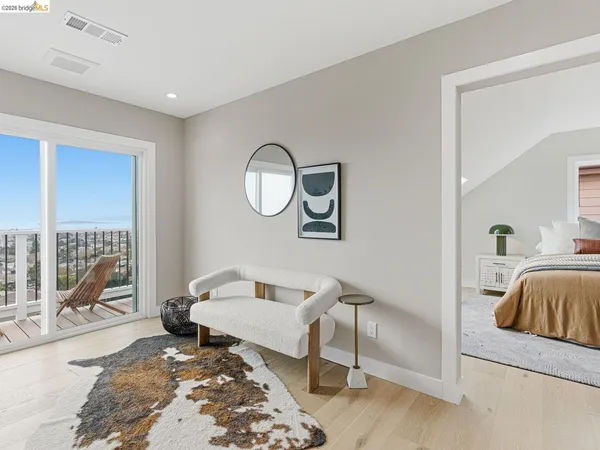 a bedroom with a bed and a chair