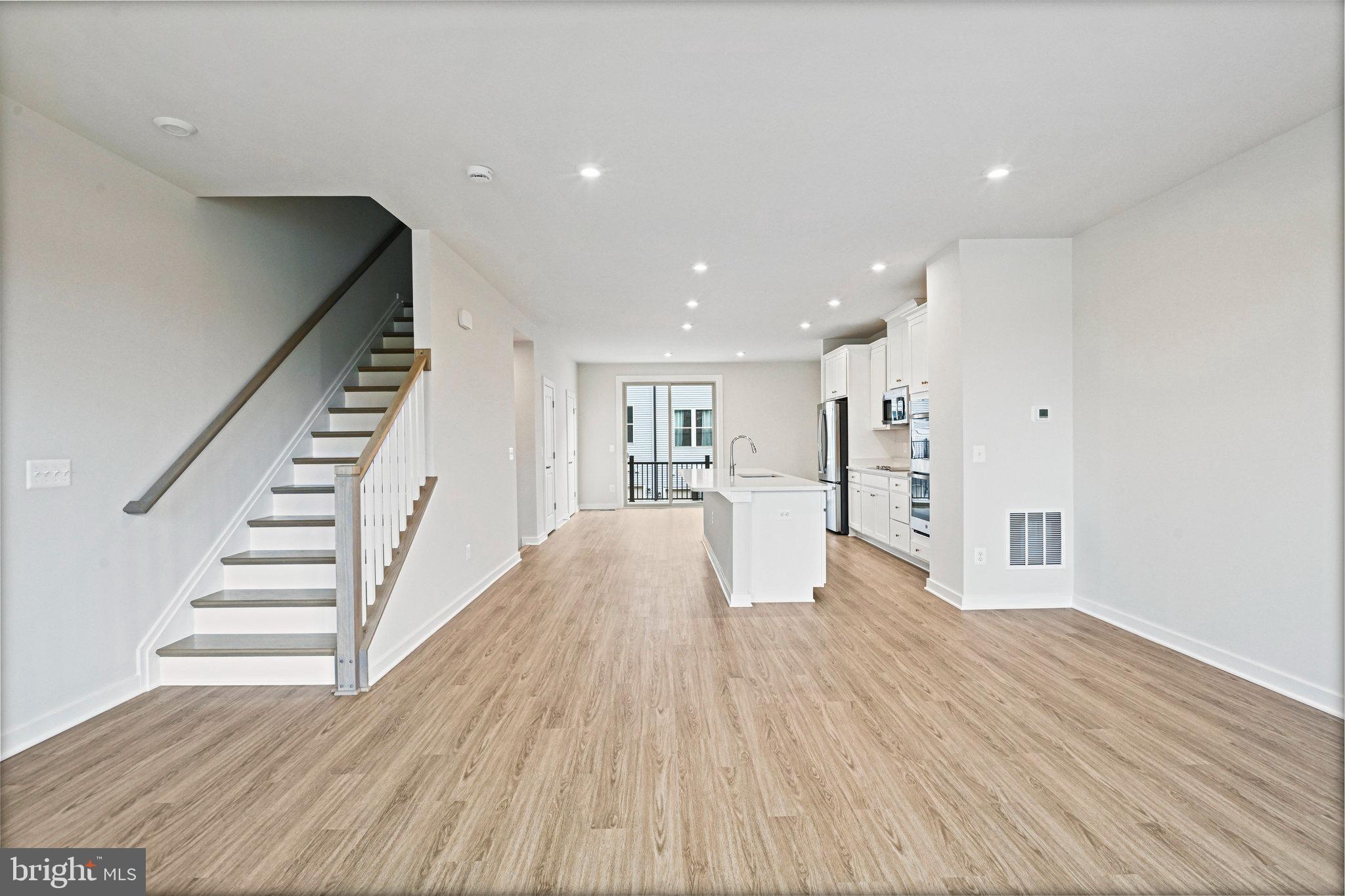 2172 Glacier Road Herndon, VA 20170 - Photo 18 of 33 a view of a kitchen with wooden floor and stairs