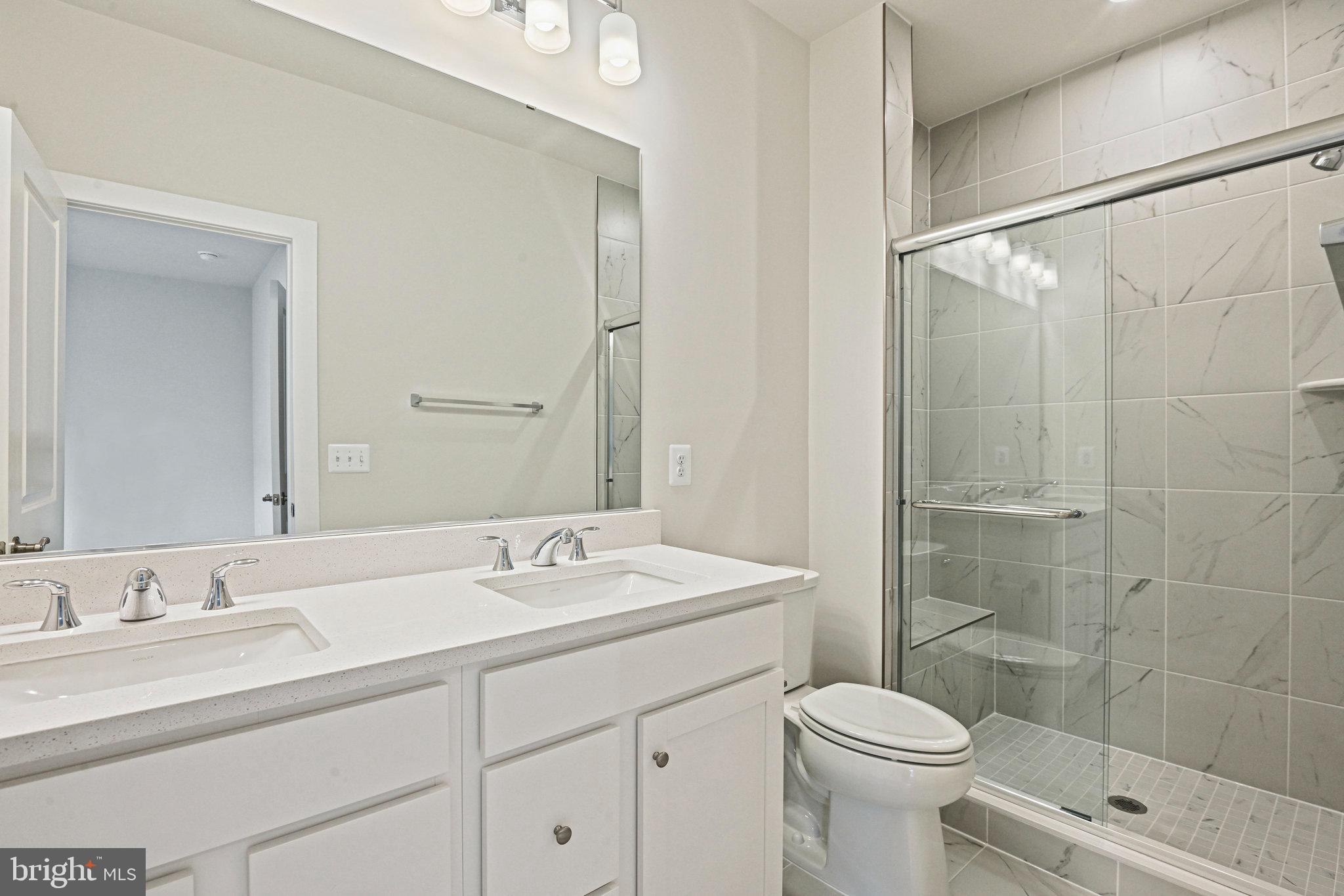 2172 Glacier Road Herndon, VA 20170 - Photo 30 of 33 a bathroom with a sink toilet and shower