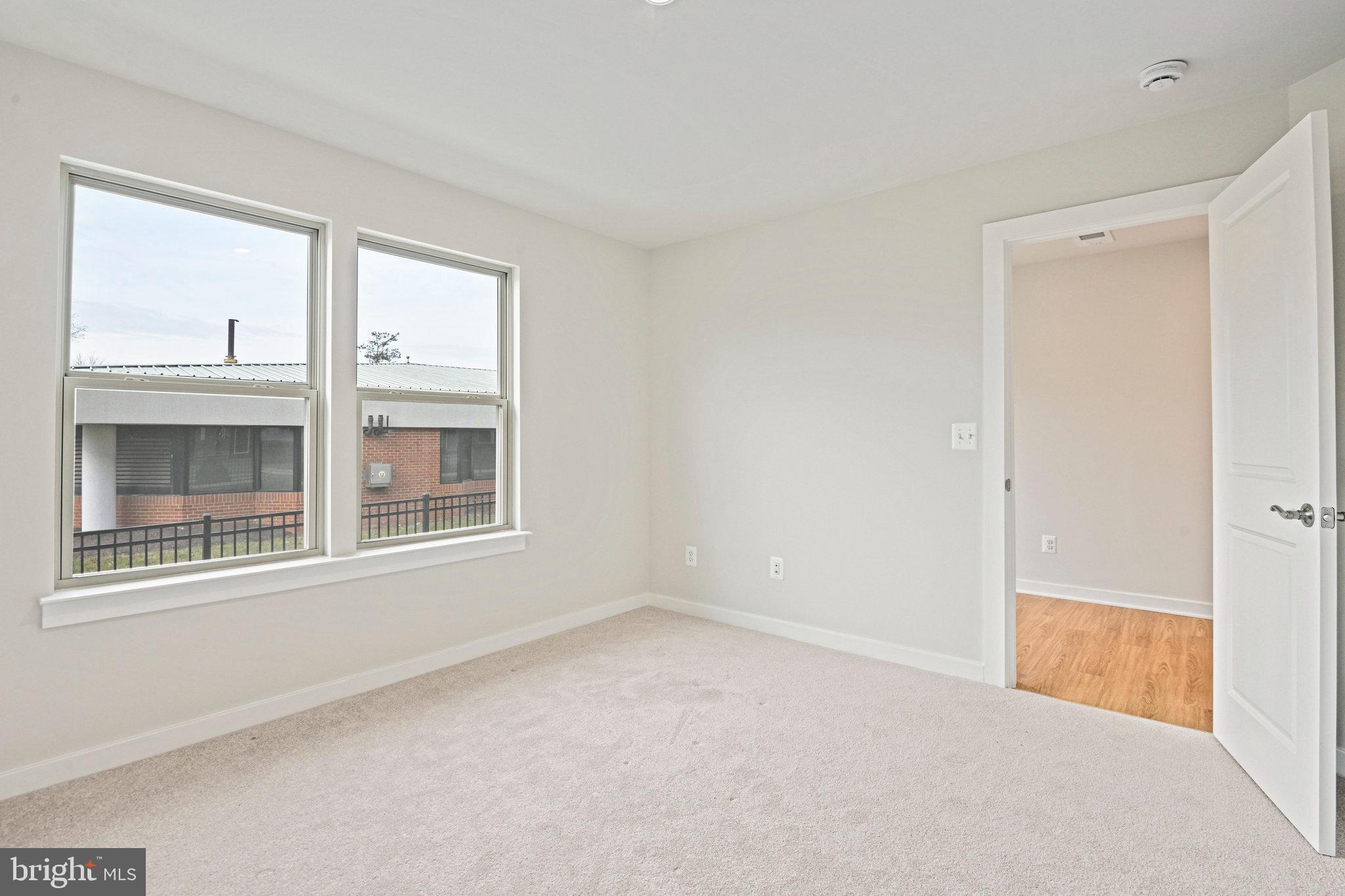 2172 Glacier Road Herndon, VA 20170 - Photo 7 of 33 a view of an empty room with a window