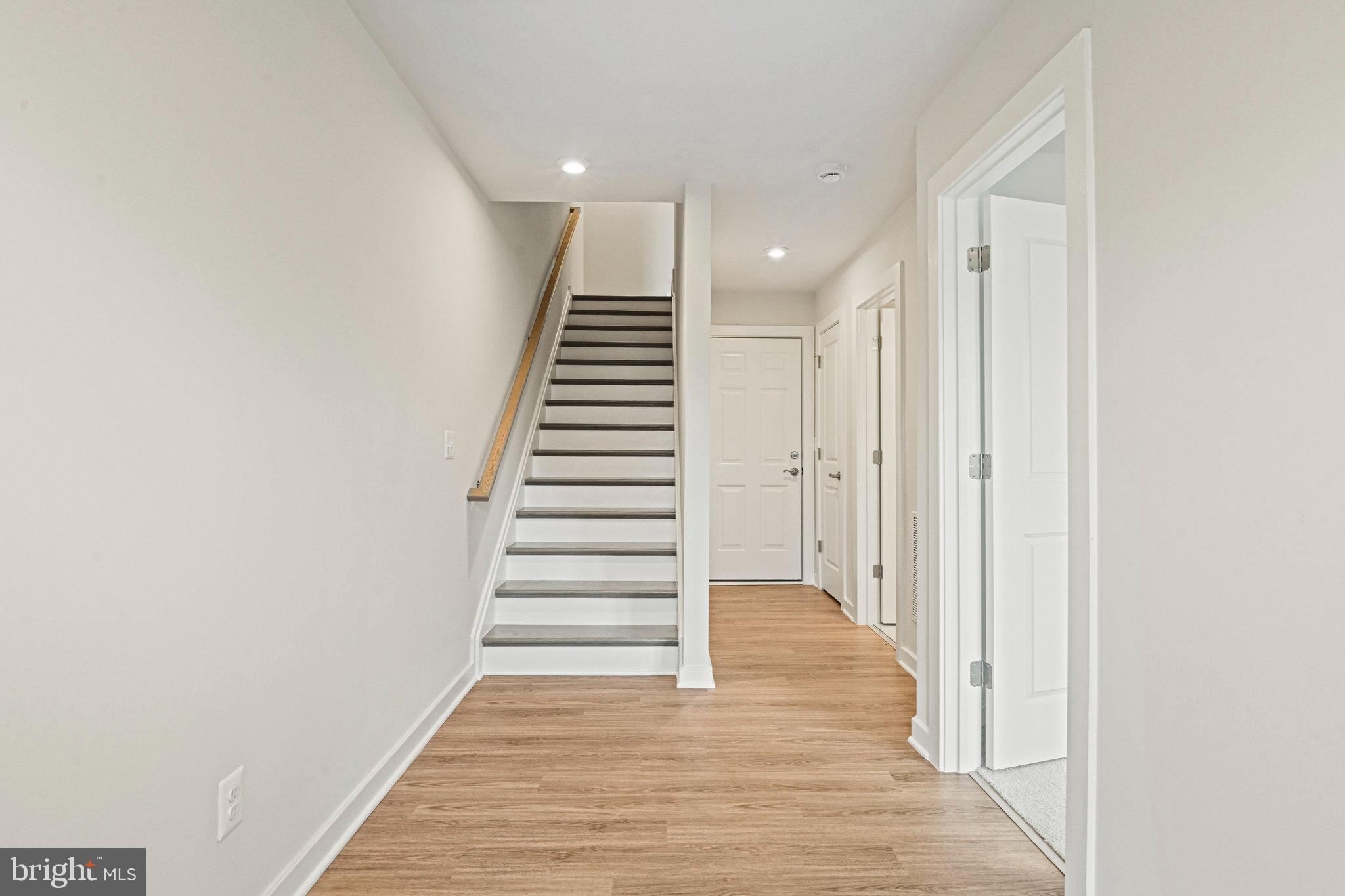 2172 Glacier Road Herndon, VA 20170 - Photo 9 of 33 a view of a hallway with wooden floor and entryway