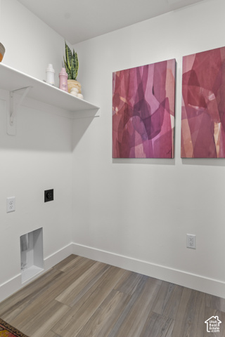 276 West 3075th Street South Logan, UT 84321 - Photo 23 of 33 Wood-finish flooring, white walls, and a built-in shelving unit
