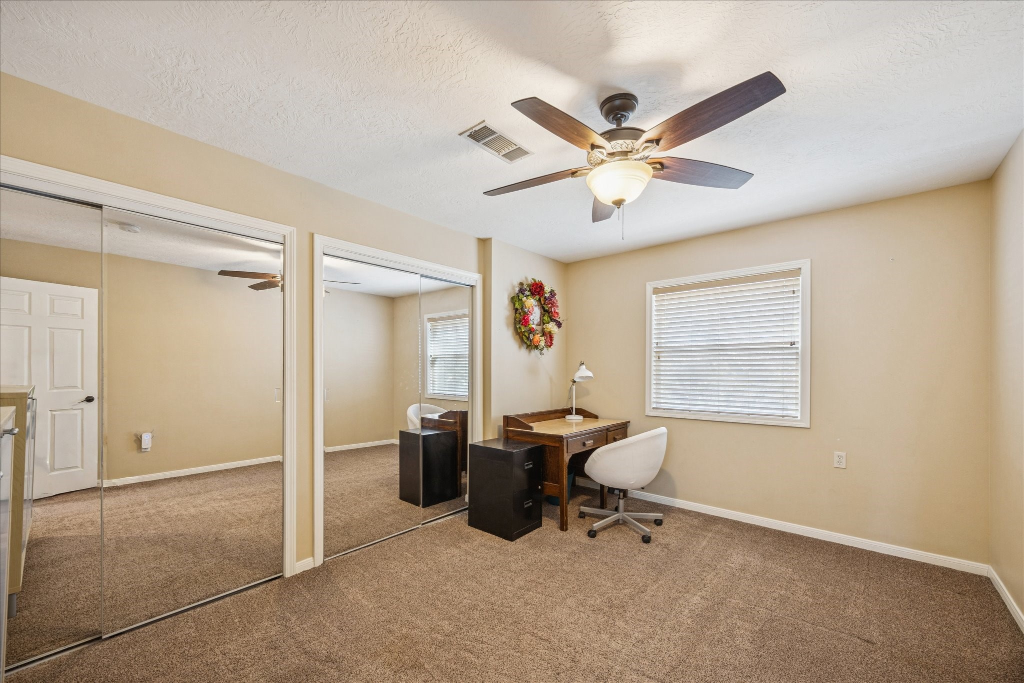 640 Piney Creek Road Bellville, TX 77418 - Photo 18 of 35 a view of workspace with a window and a ceiling fan