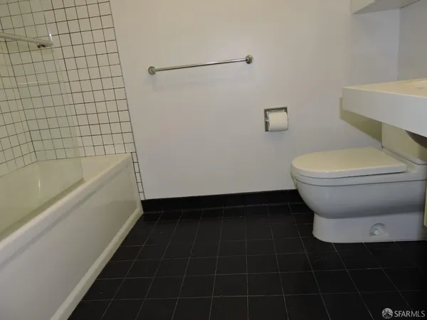 a bathroom with a sink toilet and vanity