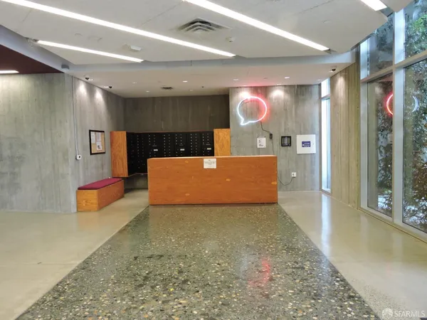 a view of a hallway with a projector and screen