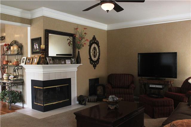 437 Ridgestone Drive Franklin, TN 37064 - Photo 7 of 20 Large den just off kitchen w/wrap around gas fireplace.