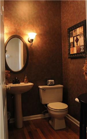 437 Ridgestone Drive Franklin, TN 37064 - Photo 8 of 20 Half bath downstairs w/warm faux finish.