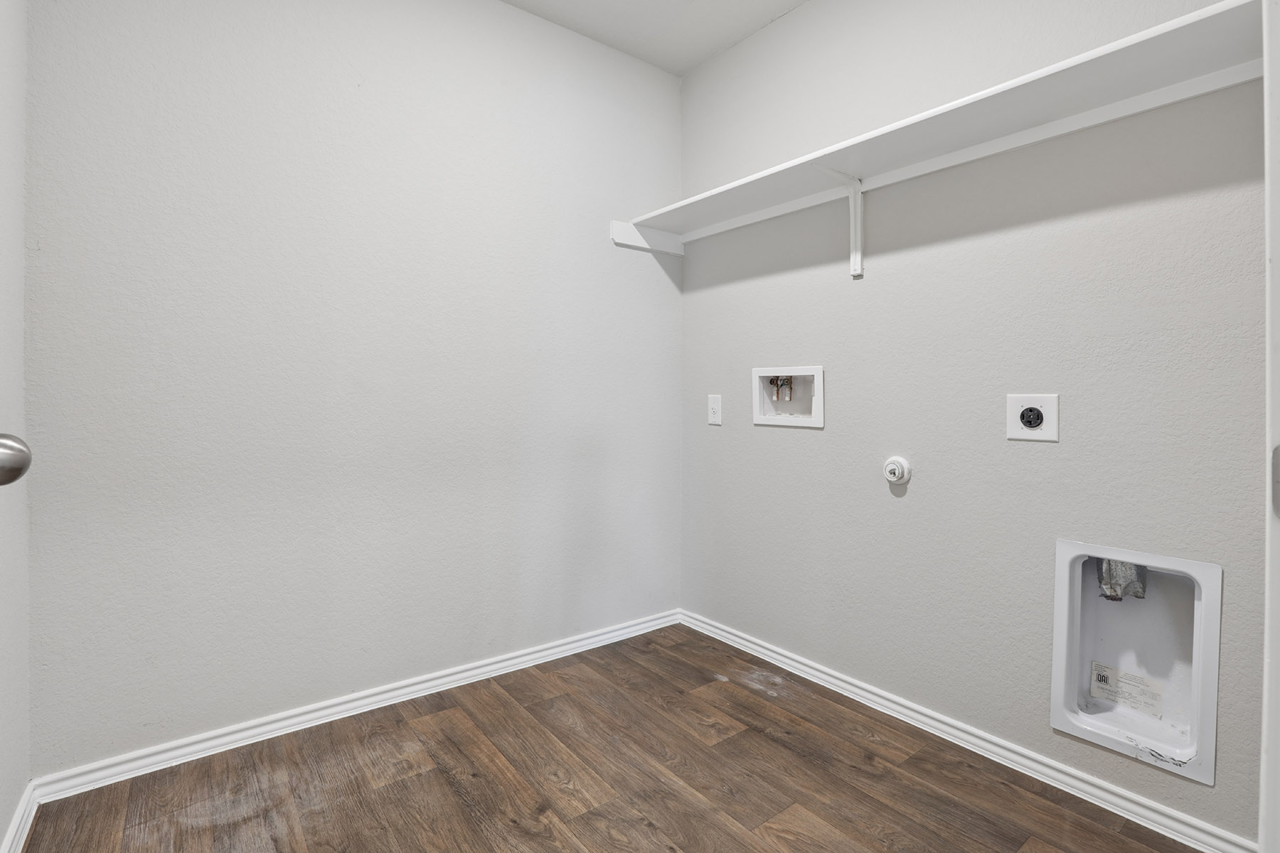 15217 Upland Willow Road Austin, TX 78724 - Photo 11 of 25 Laundry room with hookup for a gas dryer, dark wood finished floors, electric dryer hookup, and washer hookup