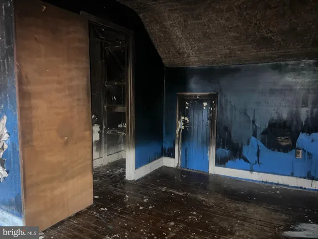 a view of a hallway with a living room