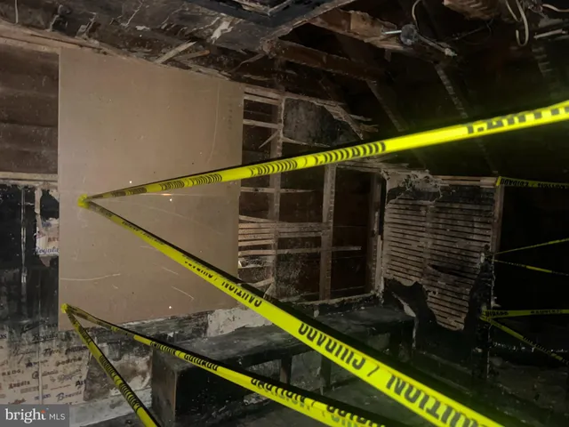 a yellow room with wooden floor