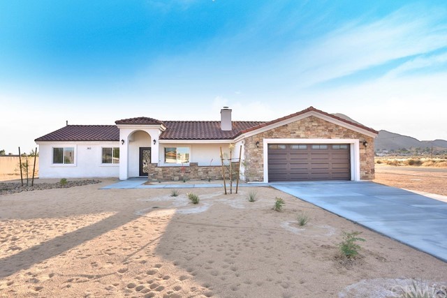 16080 Wichita Road Apple Valley, CA 92307 - Photo 1 of 1 a front view of a house with a yard