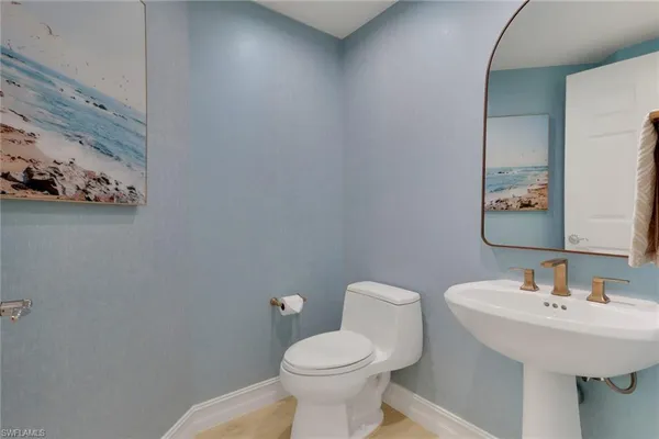 a bathroom with a sink and a toilet