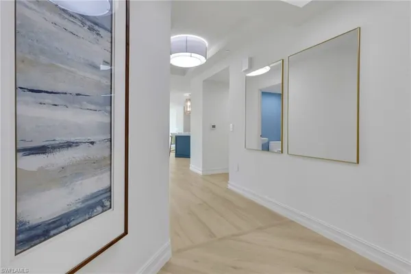 a view of a bathroom from a hallway