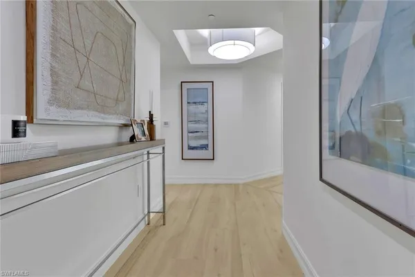 a kitchen with a sink cabinets and a wooden floor