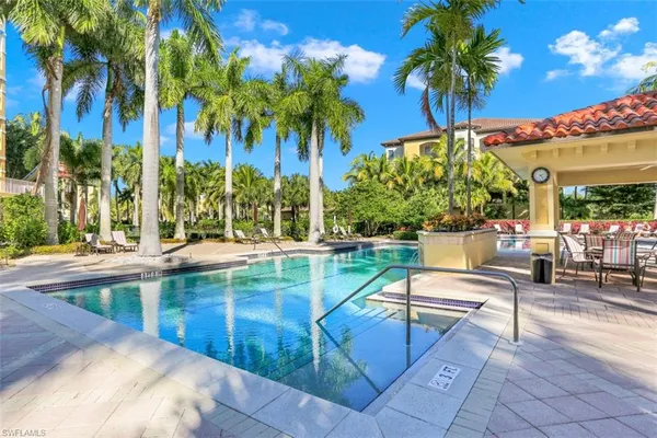 a view of a swimming pool with a patio and a patio