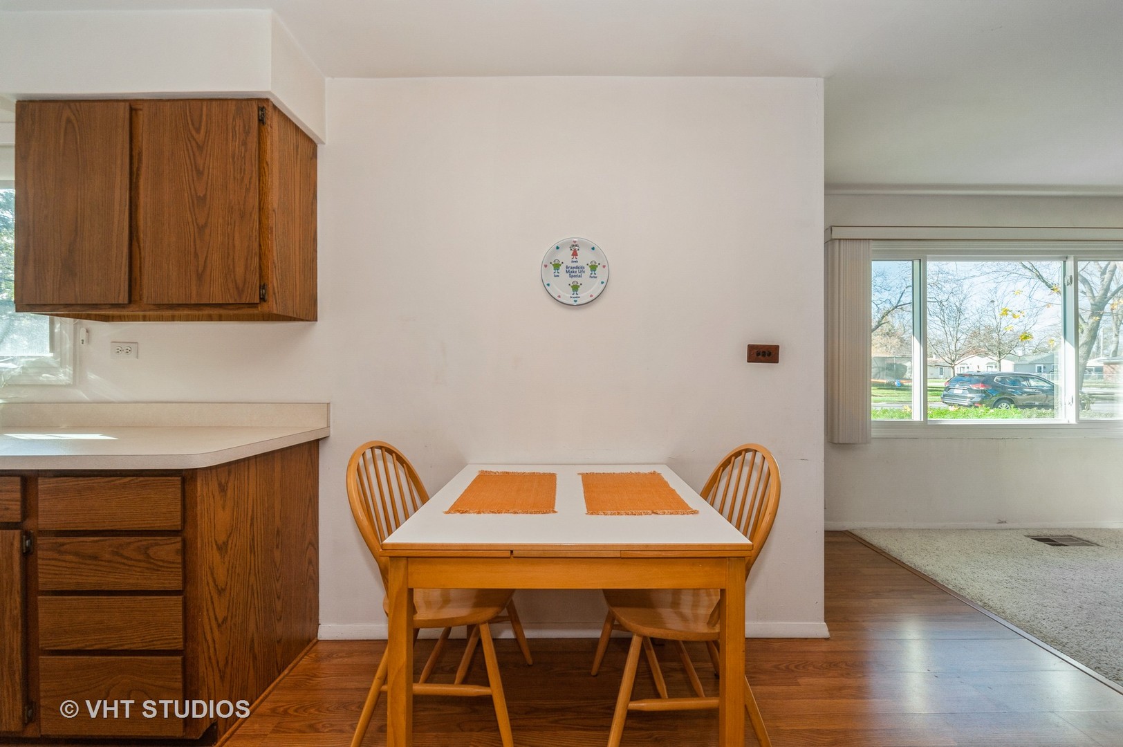 155 East Dennis Road Wheeling, IL 60090 - Photo 6 of 10 a view of a dining room with furniture and wooden floor